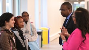 Students interacting with Darlene Saporu and Damani Piggott