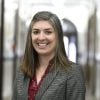 Head shot of Jill Middendorf wearing red top under blazer