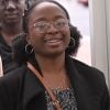 E Hop participant Makaya Chilekwa pictured smiling with black coat and brown bag strap.