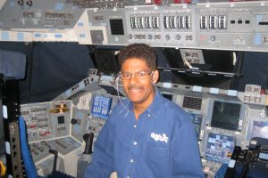 Ken Phillips sits in the cockpit of Space Shuttle Endeavour