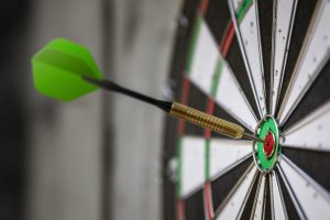 A dart hitting a dartboard