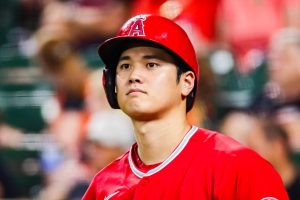 Shohei Ohtani, at bat, looking down the third base line.
