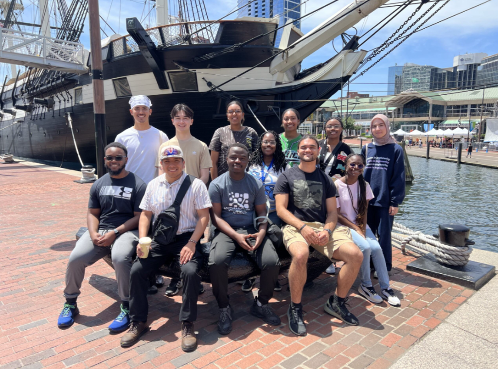 Group photo of the 2024 PROPEL students at the Baltimore Inner Harbor.