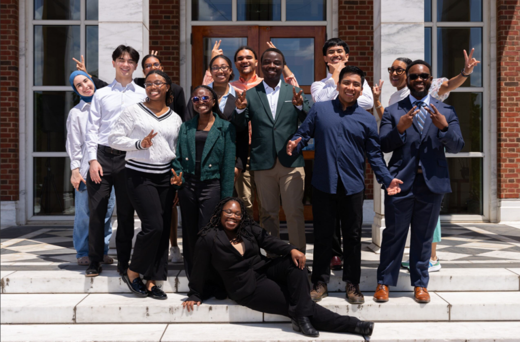 A group photo of the 2024 PROPEL students, all smiling and holding peace signs.
