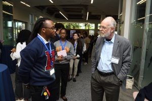 A Howard student speaking with WSE faculty.