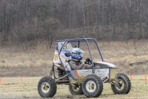 Student driving the off-road competition vehicle