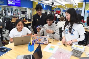 Four Hopkins students working on Design Day prototype