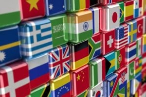A wall of cubes, showing different country flags.