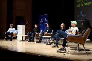 Matias Unberath speaks during the seated panel portion of the symposium.
