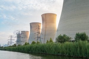 Photo of a nuclear power plant, located near water