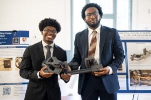 Two young men presenting during PROPEL