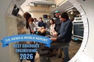 Mathias Unberath and lab students test out a robotics-enhanced operating room demo with test dummy and imaging machines. 