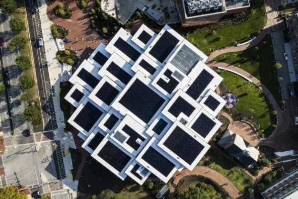 A top-down photo of the Bloomberg Student Center. The roof is covered in solar panels.
