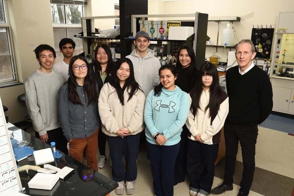 10 members of the Searson Lab pose for a group photo in their laboratory. 